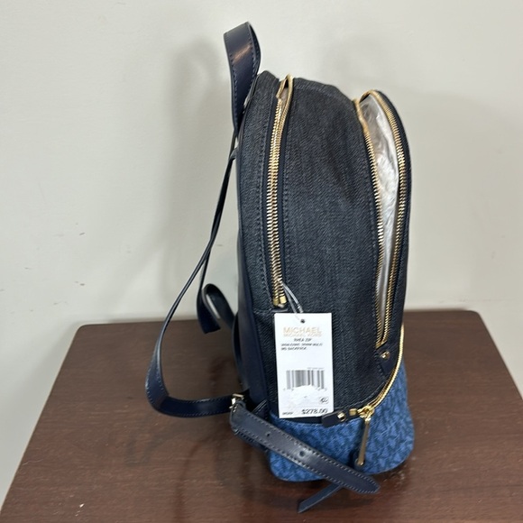 Michael Kor’s Rhea zip Denim multi mini backpack purse and matching wallet